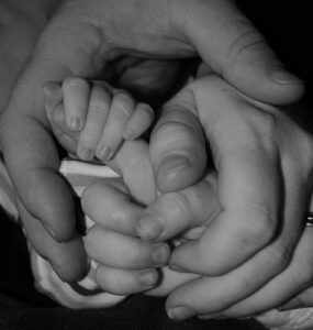 Image of hands demonstrating loving relationships.